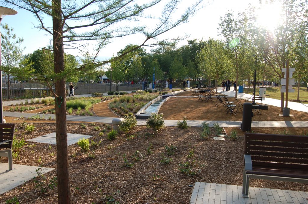 This image depicts sections of lawn, soil beds and pathways at the Myriad Botanical Gardens in Oklahoma City, Oklahoma.